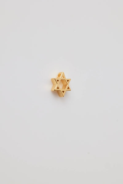 The side view of a Star of David charm made from polished 18-karat gold with a sleek finish. The charm features two interlocking triangles that create the iconic six-pointed star, symbolizing unity and heritage.