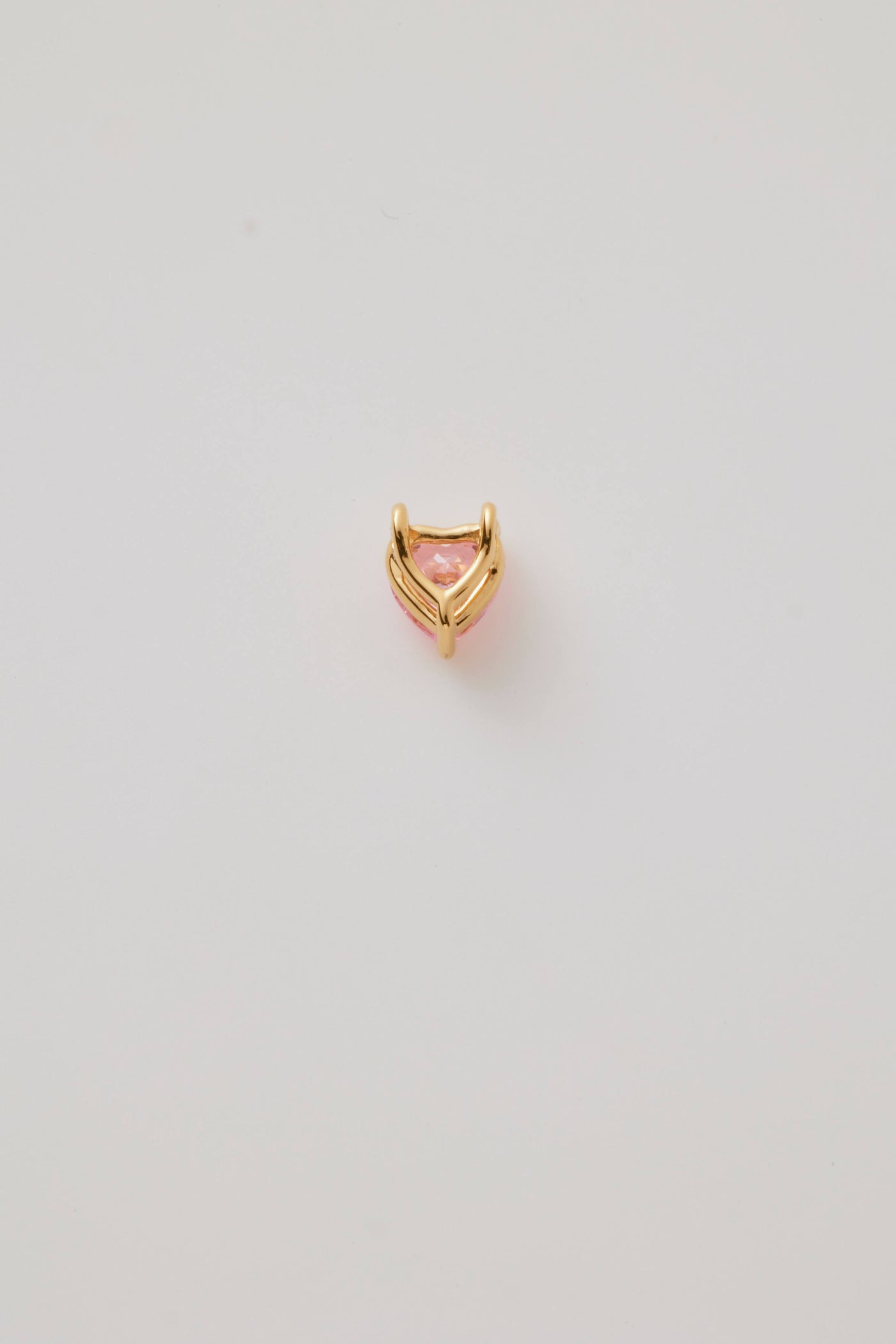 Reverse back view of a pink faceted heart charm set in polished gold, featuring a sparkling gemstone-like finish. Elegant and perfect for any chain.