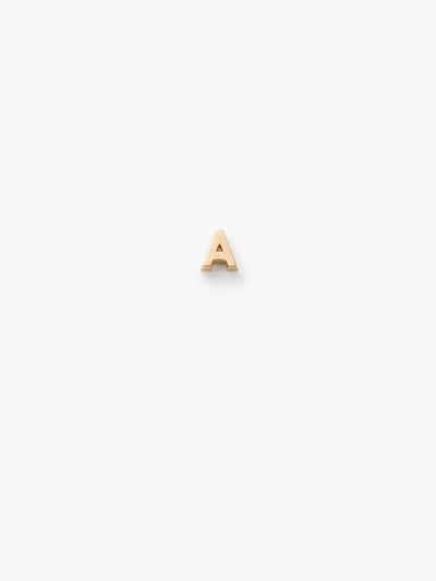 An elegant, 18k gold "A" earring is centered on a plain, white background. The uppercase letter "A" glimmers in solid gold.