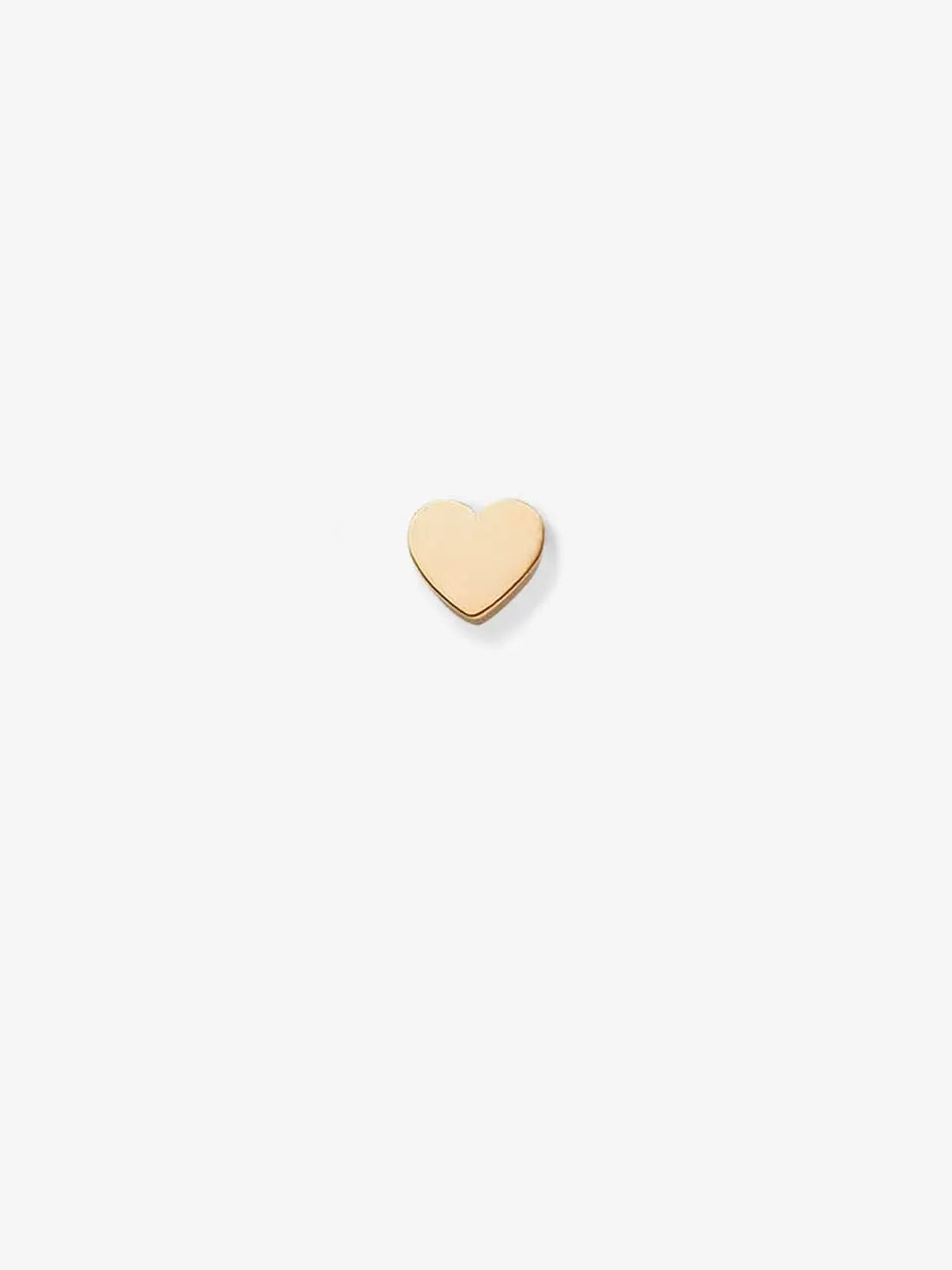 The Heart in 18k Gold features a small, simple heart charm made of 18k solid gold, centered against a plain white background and showcasing an elegant openable connector clasp.