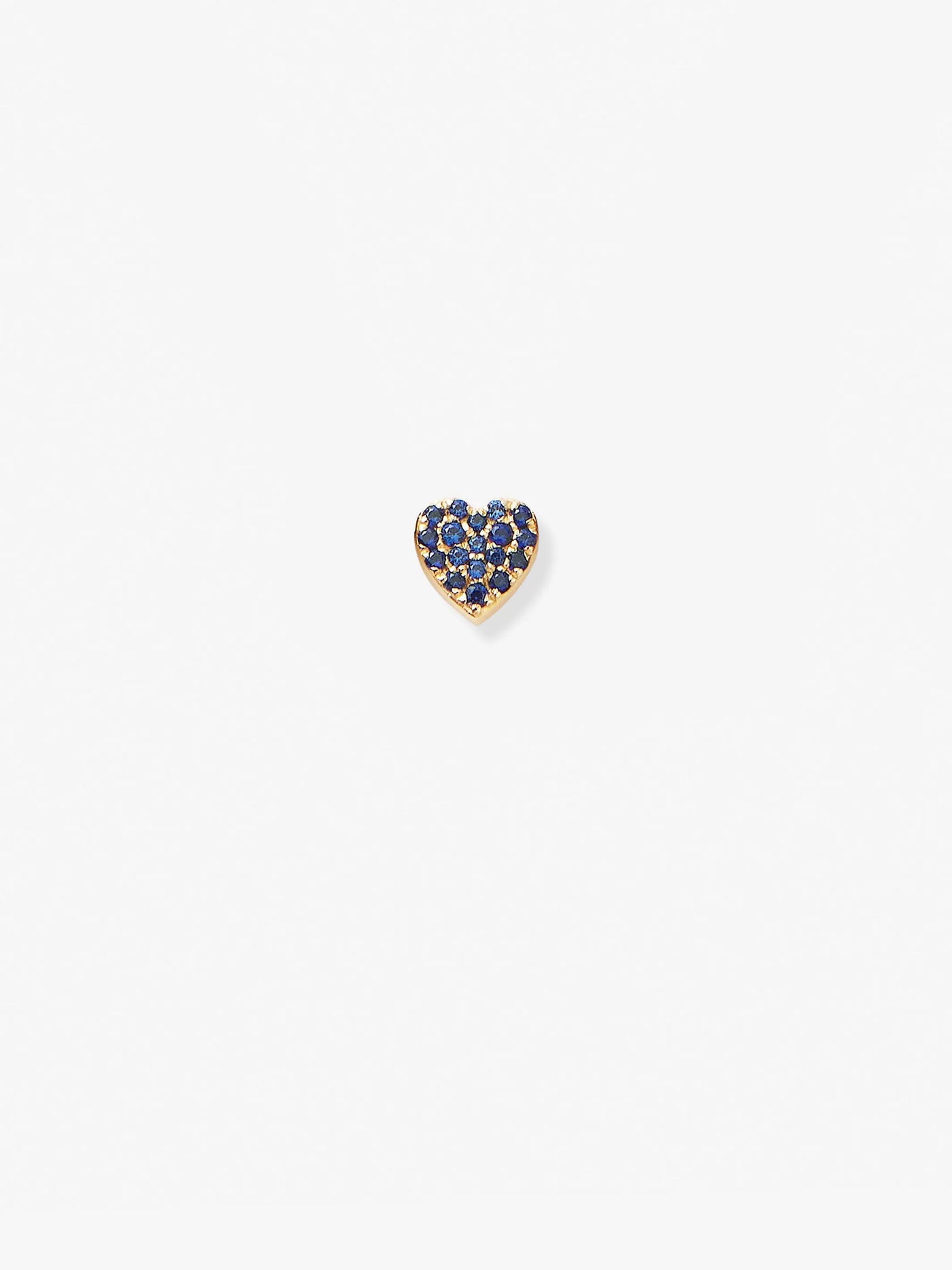 An exquisite 18k solid gold heart-shaped pendant, titled "Heart in Blue Sapphire and 18k Gold," features stunning blue sapphires, set against a plain white background.