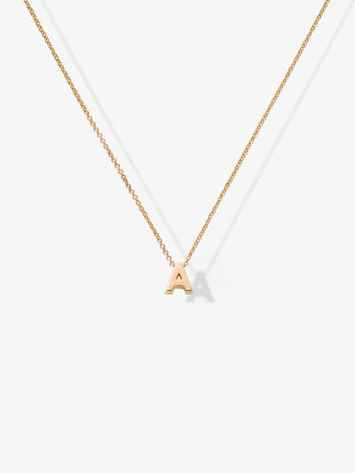 The "Letter A Necklace in 18k Gold" features a delicate pendant shaped like the letter "A," crafted from solid 18k gold. The necklace boasts a thin, lightweight chain with an openable connector clasp, ensuring ease of wear. Centered elegantly on the chain, the pendant adds a subtle touch of refinement. The plain white background accentuates the simplicity and elegance of this exquisite piece.