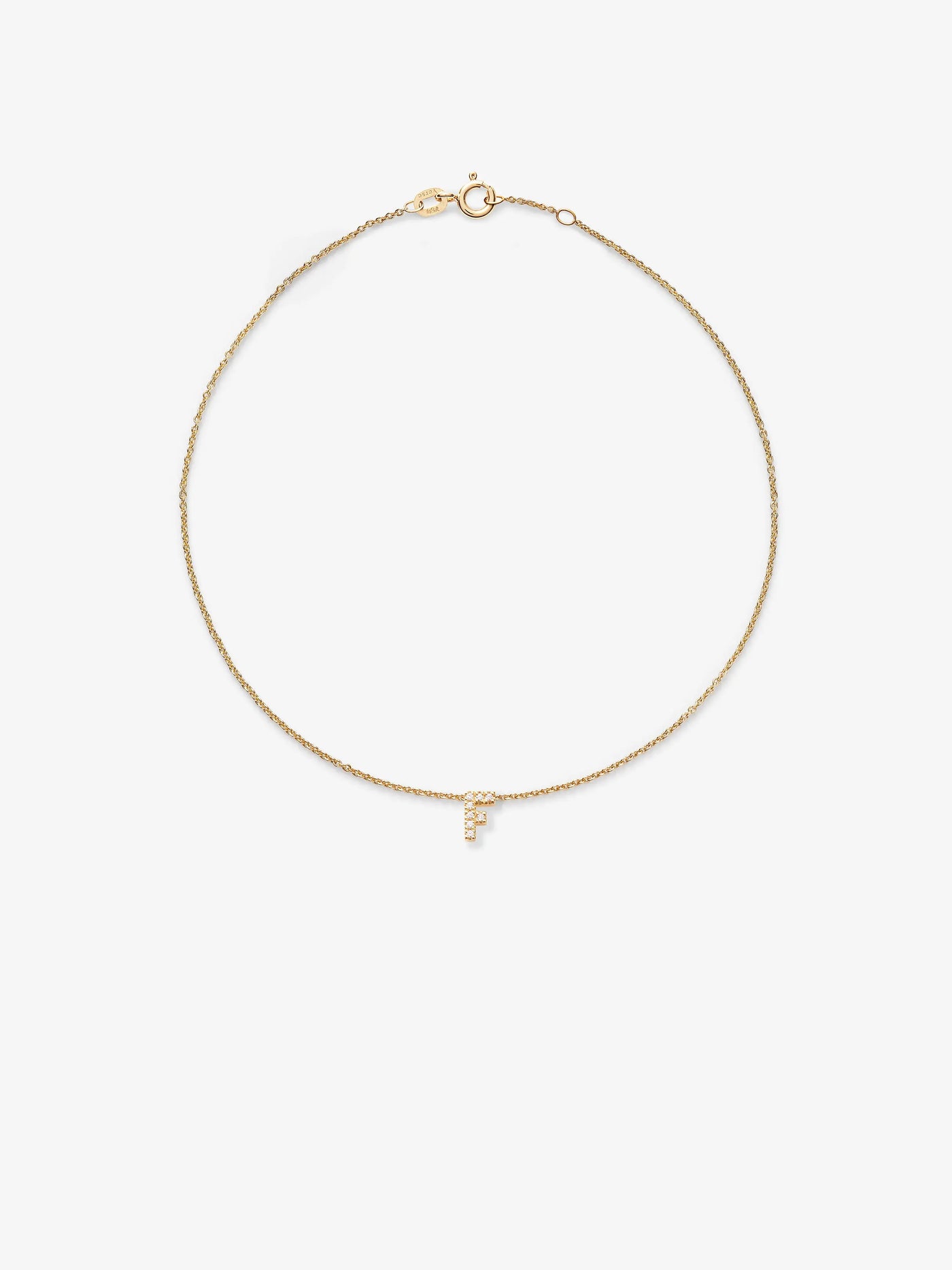 A delicate 18k solid gold bracelet adorned with a small, hanging letter 'F' pendant encrusted with diamonds. The custom-made chain features a simple clasp mechanism and is set against a plain white background.