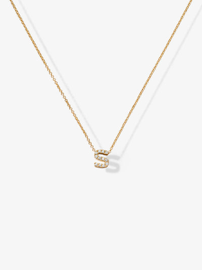 The Letter S Necklace in Diamonds and 18k Gold showcases a small, diamond-encrusted "S" pendant on a fine, 18k gold chain. Set against a plain, white background, the necklace's elegant simplicity is perfectly highlighted.