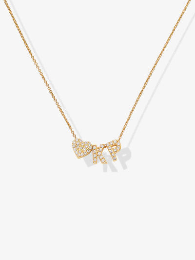 A delicate 18k solid gold necklace featuring two capital letters and a heart, all encrusted with small, sparkling diamonds. The pendant hangs from a fine chain, creating an exquisite personalized necklace. (Product Name: Two Letters and Heart Necklace in Diamonds and 18k Gold)