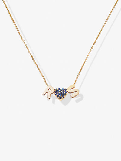 Product Description: The Two Letters and Blue Sapphire Heart Necklace in 18k Gold showcases an 18k solid gold delicate chain, featuring three customizable charms. Adorning the necklace are the letter "R," a blue sapphire heart charm centered, and the letter "S." These enchantingly spaced charms hang along the elegant chain, presenting a stunning look set against a pristine white background.