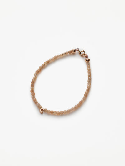 Hand-strung bracelet with natural moonstone gemstones and miniature three-dimensional letter in 18k solid rose gold