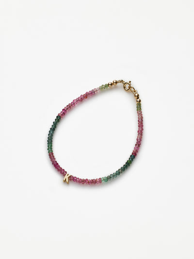 Hand-strung bracelet with natural, tourmaline gemstones and miniature three-dimensional letter in 18k solid gold