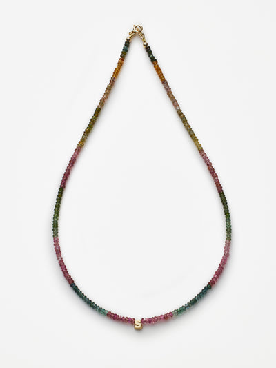 Hand-strung necklace with natural, faceted tourmaline gemstones and miniature three-dimensional letter in 18k solid gold
